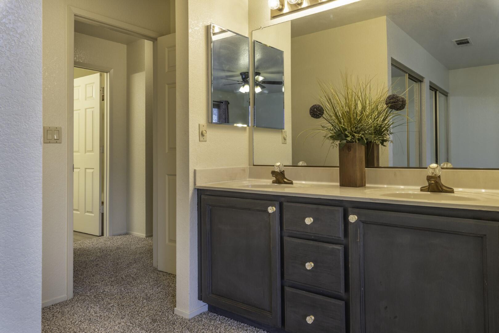 200 Ridgetop Drive, Unit 36 Redding, CA 96003 - Photo 15 of 24 a bathroom with a double vanity sink and mirror