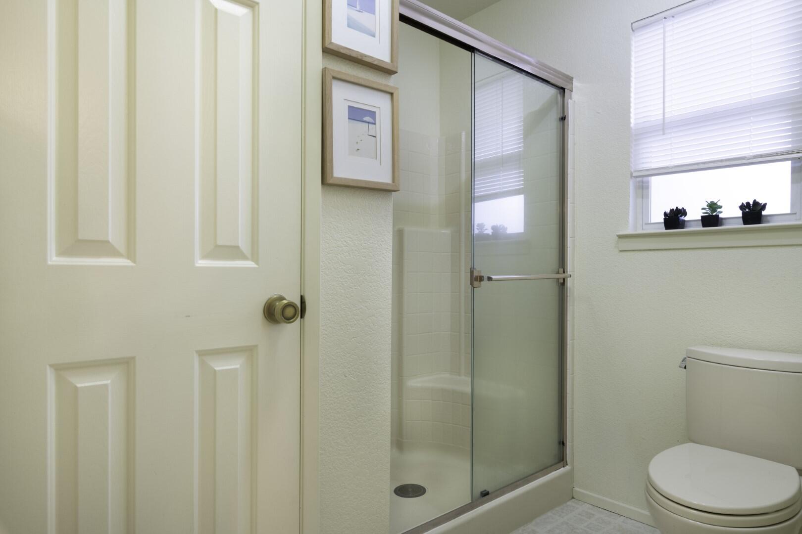 200 Ridgetop Drive, Unit 36 Redding, CA 96003 - Photo 16 of 24 a bathroom with a shower a toilet and a sink