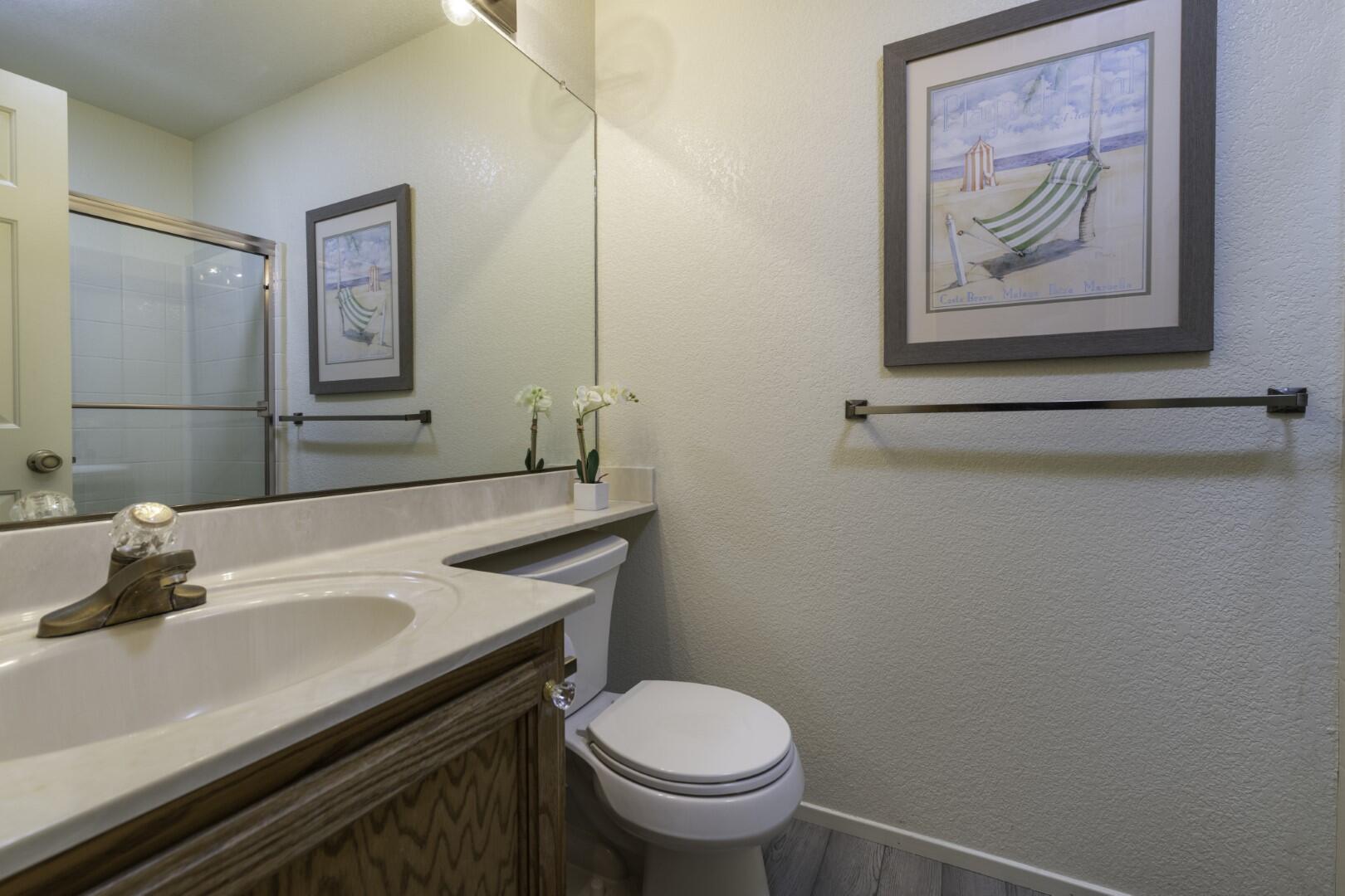 200 Ridgetop Drive, Unit 36 Redding, CA 96003 - Photo 18 of 24 a bathroom with a sink a toilet and mirror
