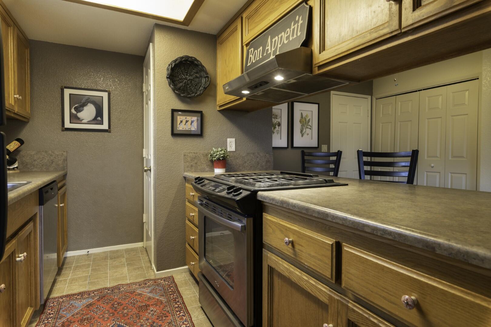 200 Ridgetop Drive, Unit 36 Redding, CA 96003 - Photo 8 of 24 a kitchen with a stove and a refrigerator