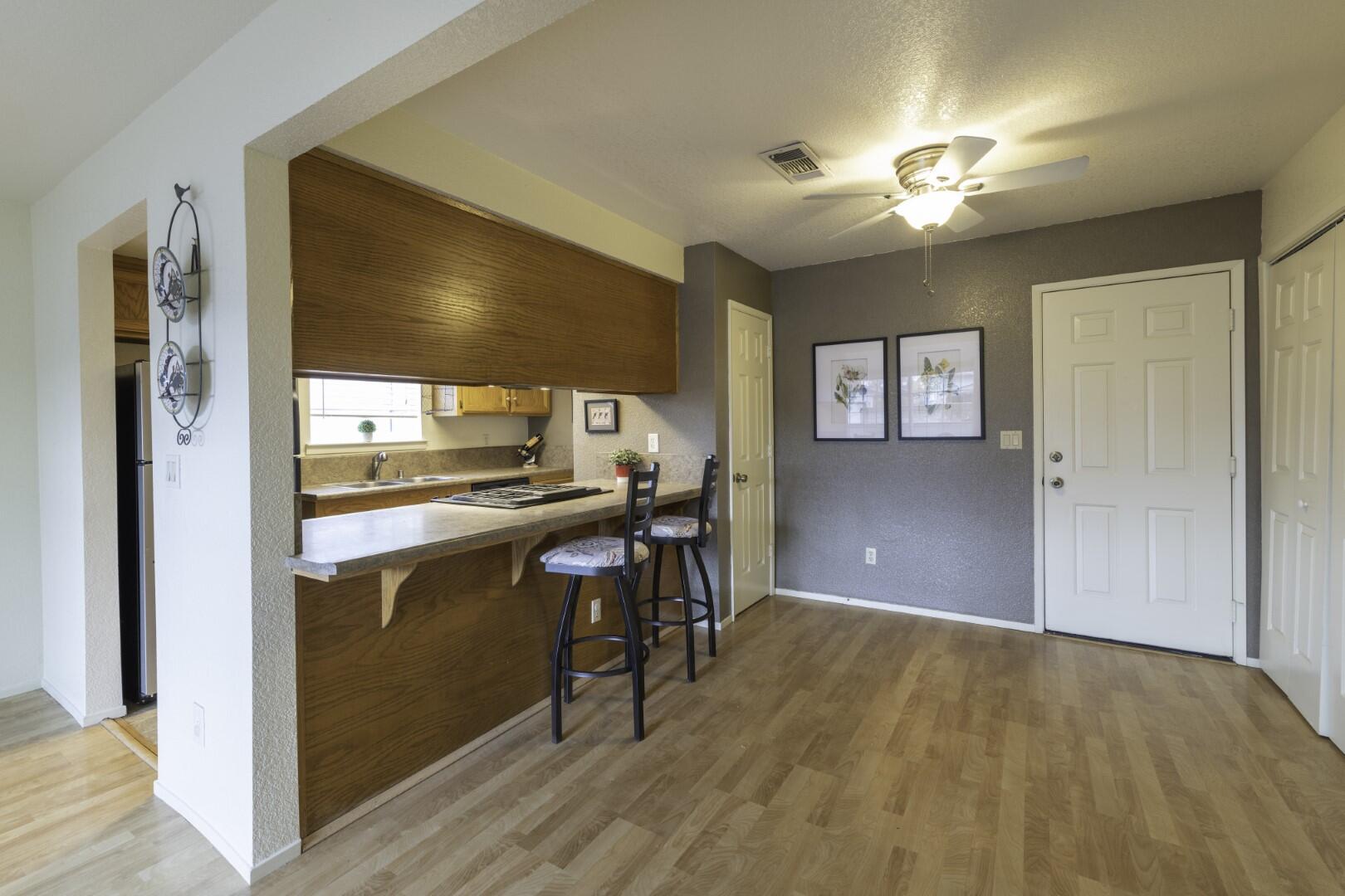 200 Ridgetop Drive, Unit 36 Redding, CA 96003 - Photo 10 of 24 a view of kitchen with furniture and wooden floor
