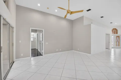 a kitchen with stainless steel appliances granite countertop a refrigerator a oven and a sink