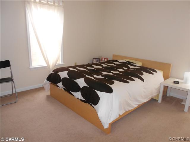 151 Sunset Ridge Drive Farmville, VA 23901 - Photo 4 of 12 a bedroom with a bed and a window