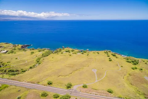 a view of a big room with wooden floor and cabinet