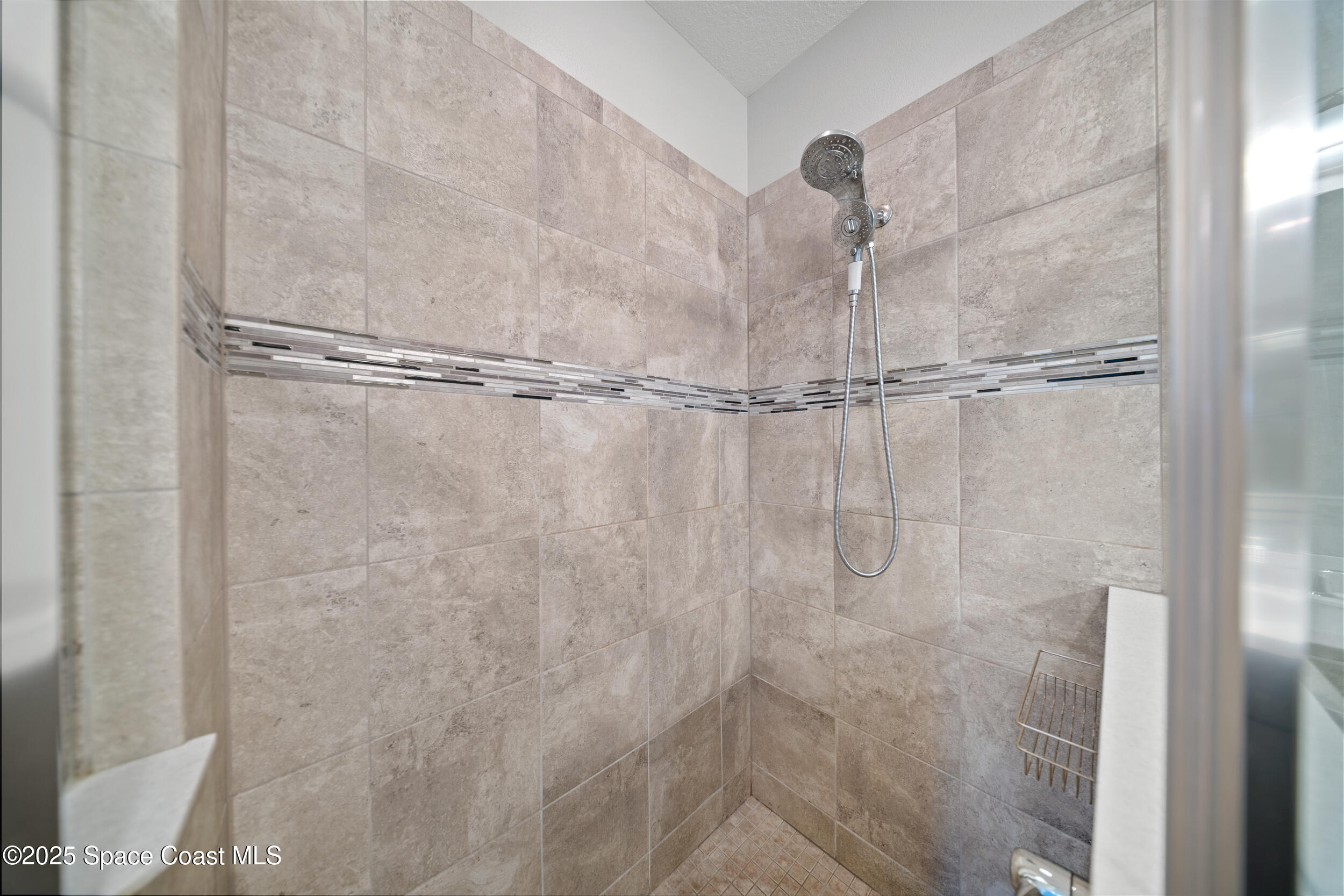 8830 Napolo Drive Melbourne, FL 32940 - Photo 18 of 36 a bathroom with a shower
