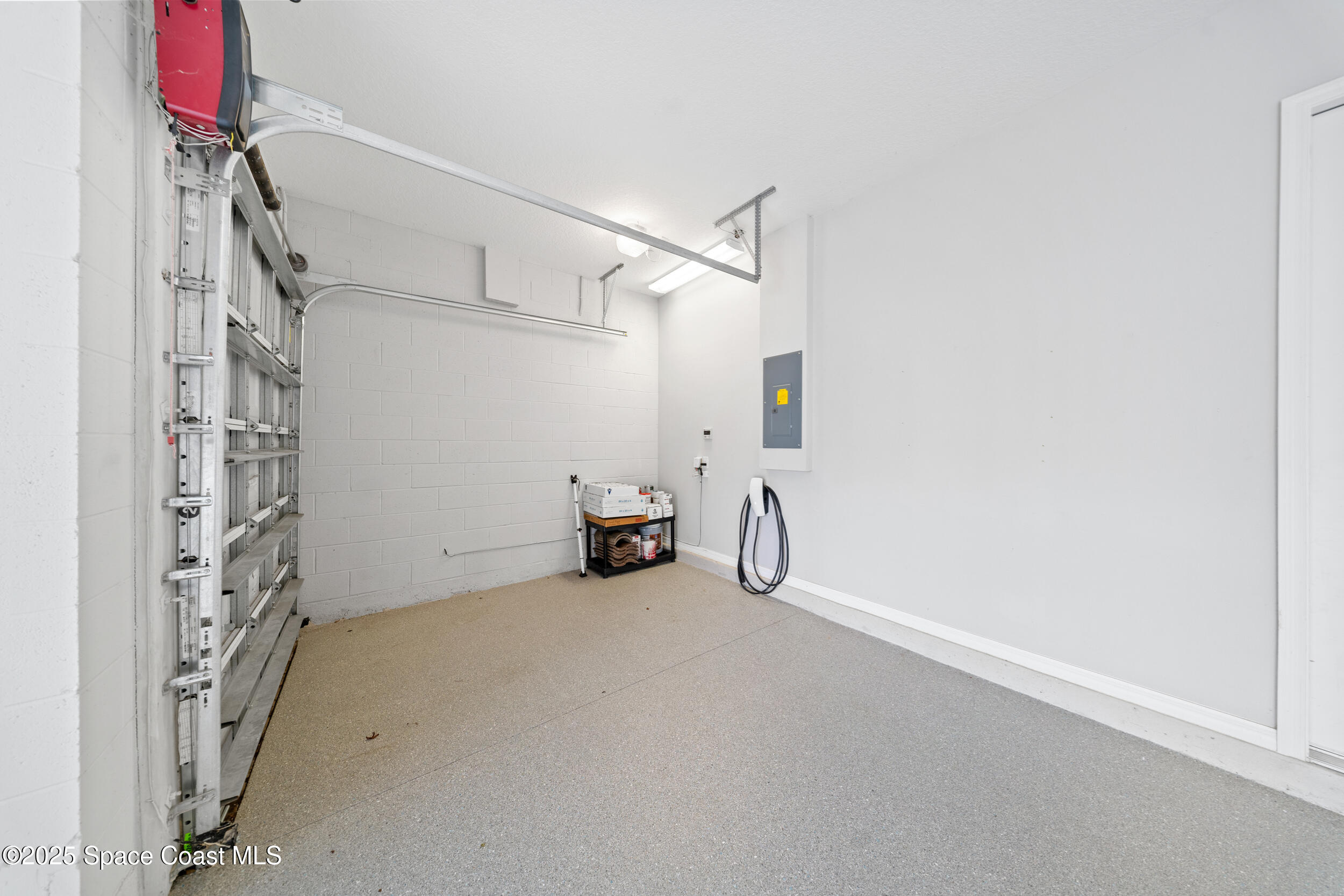 8830 Napolo Drive Melbourne, FL 32940 - Photo 26 of 36 a view of a room with rack on the wall and a window