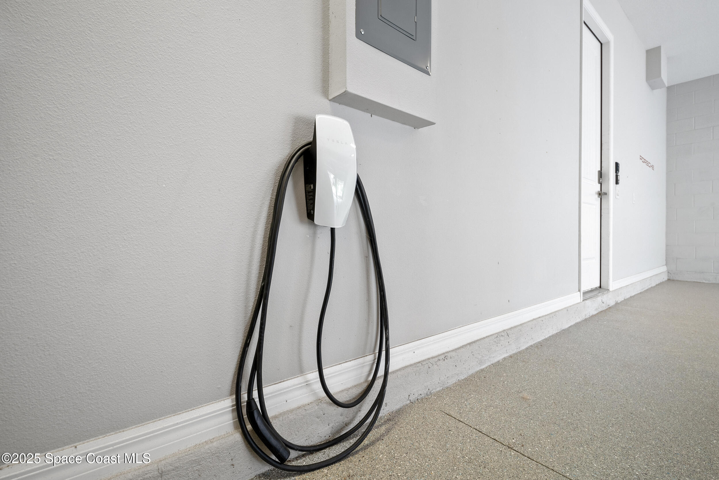 8830 Napolo Drive Melbourne, FL 32940 - Photo 27 of 36 a picture of a room with wooden floor and white walls