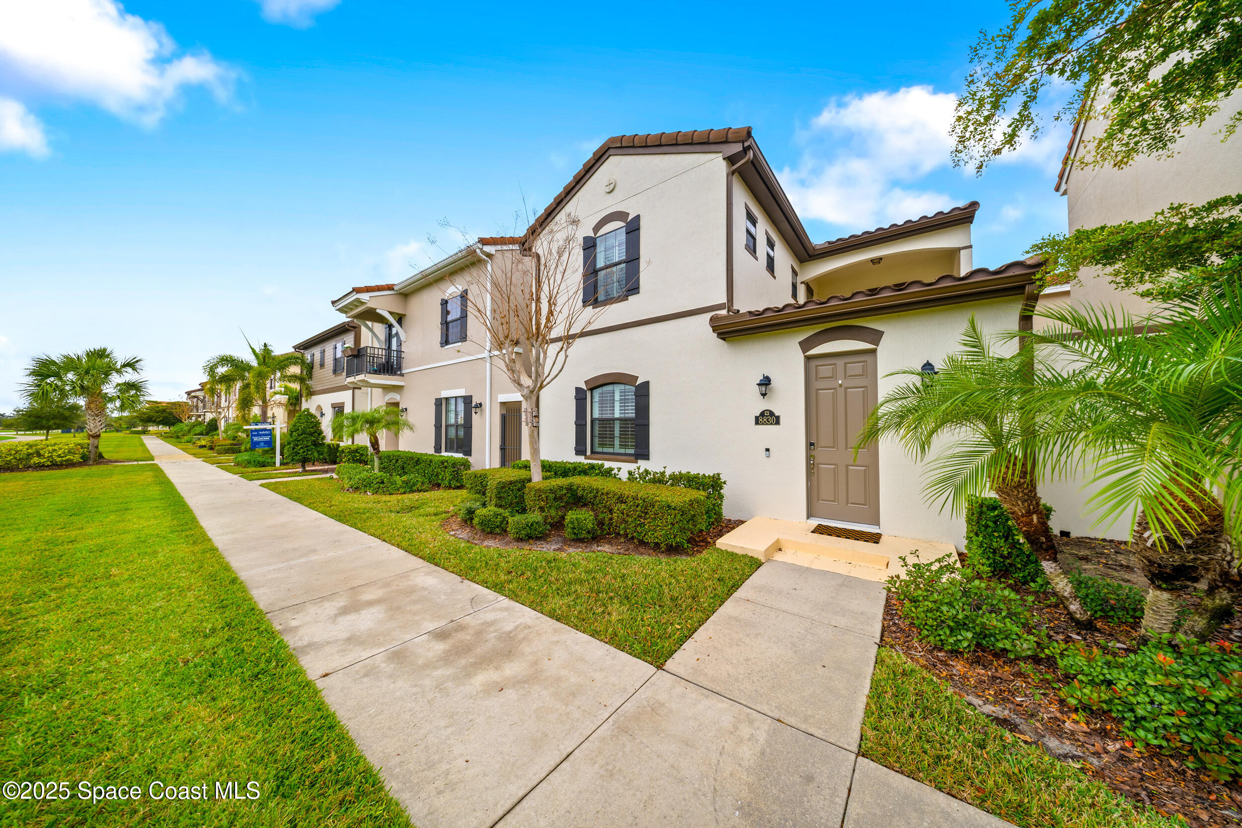 8830 Napolo Drive Melbourne, FL 32940 - Photo 29 of 36 a front view of a house with a yard