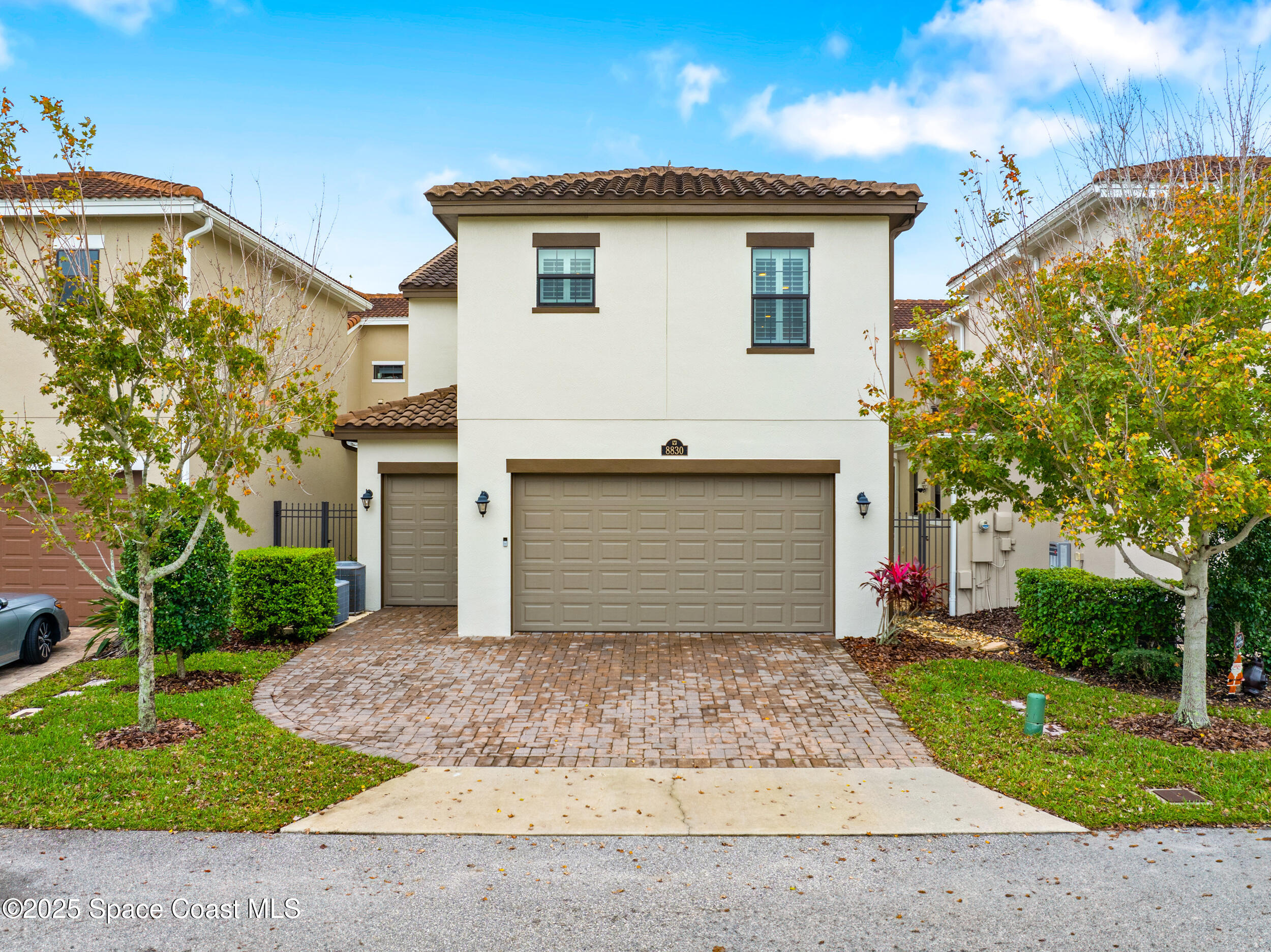 8830 Napolo Drive Melbourne, FL 32940 - Photo 30 of 36 a front view of a house with a yard