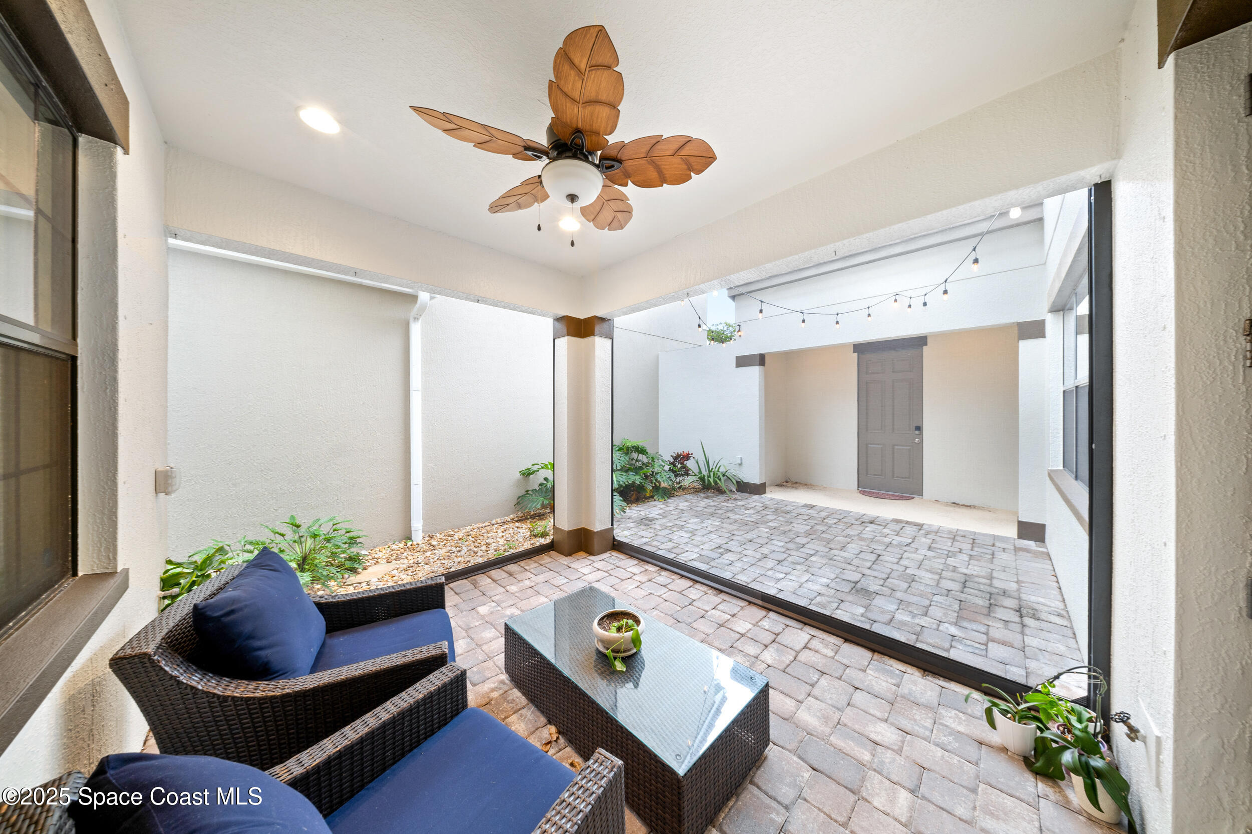8830 Napolo Drive Melbourne, FL 32940 - Photo 3 of 36 a living room with furniture and a rug