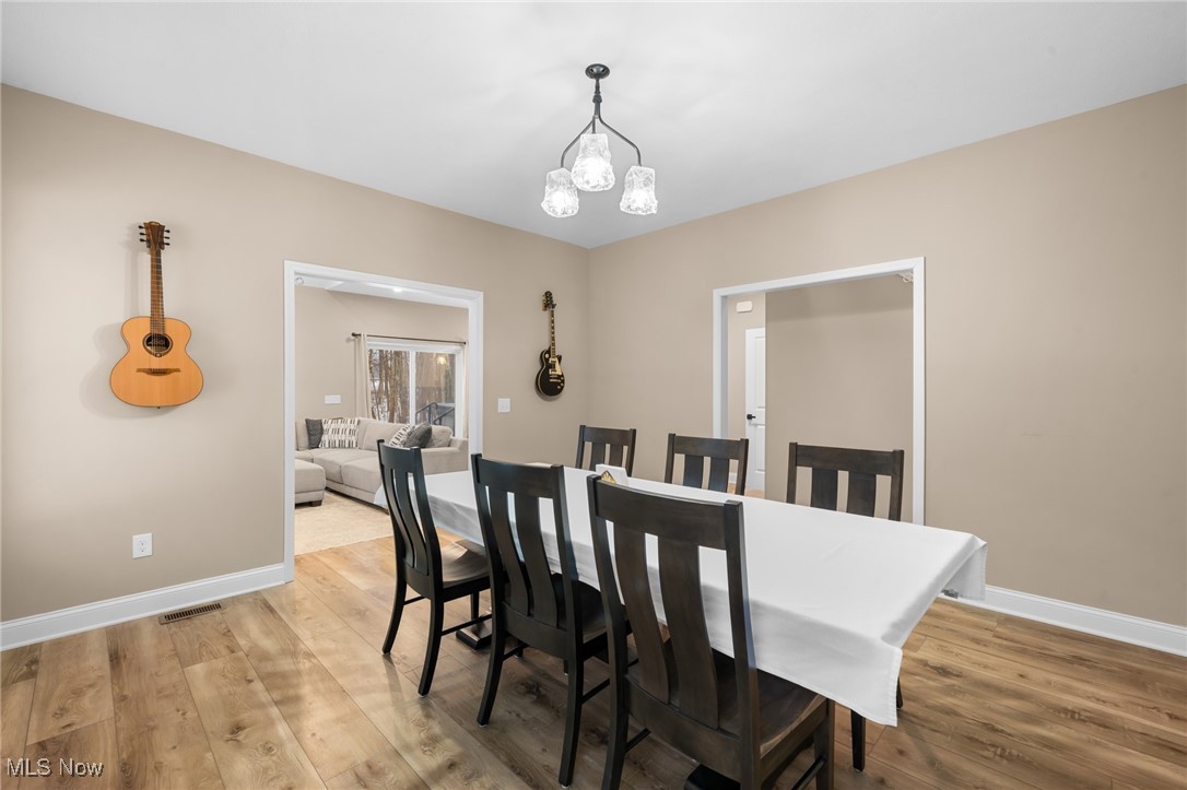 39600 Aurora Road Solon, OH 44139 - Photo 9 of 49 Dining room featuring a chandelier