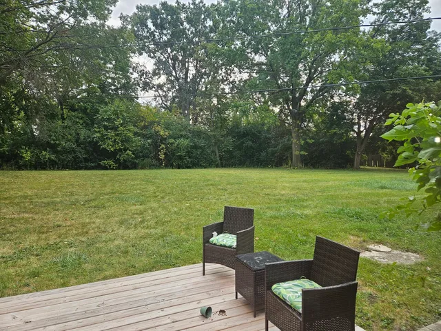 a view of a lake with furniture