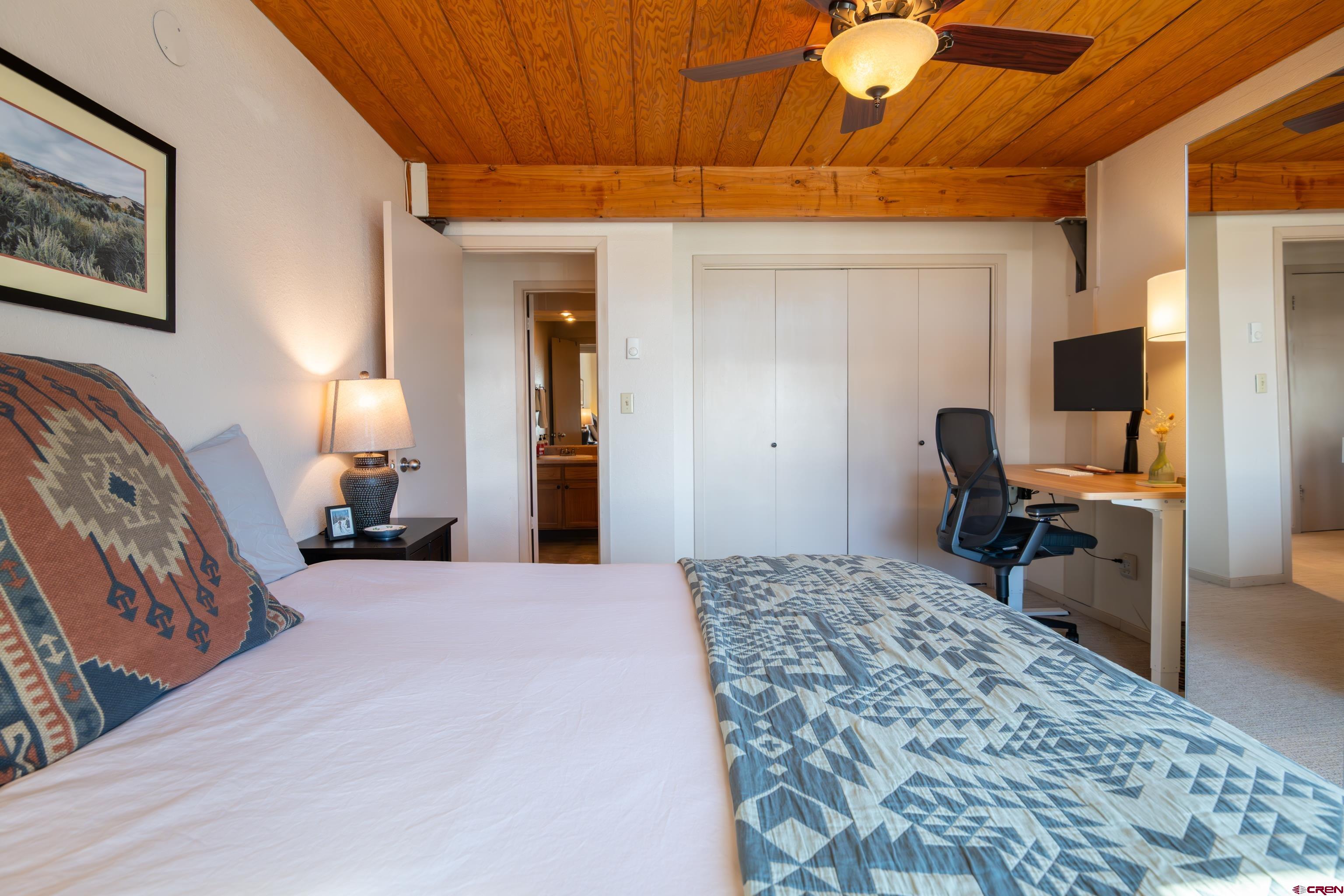 25 Emmons Road, Unit 41 Crested Butte, CO 81225 - Photo 19 of 45 a bedroom with a bed and wooden floor