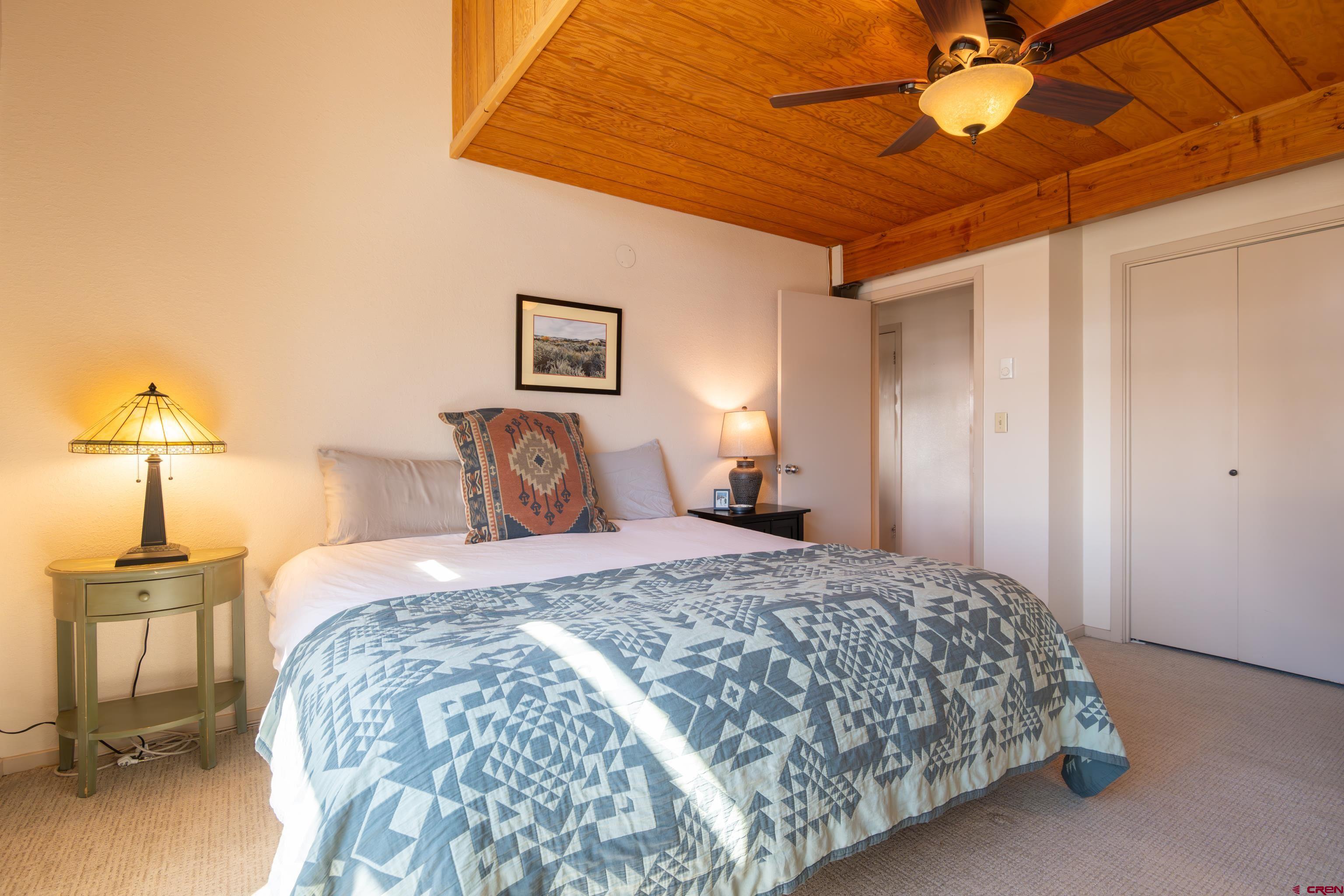 25 Emmons Road, Unit 41 Crested Butte, CO 81225 - Photo 20 of 45 a bedroom with a bed and a mirror