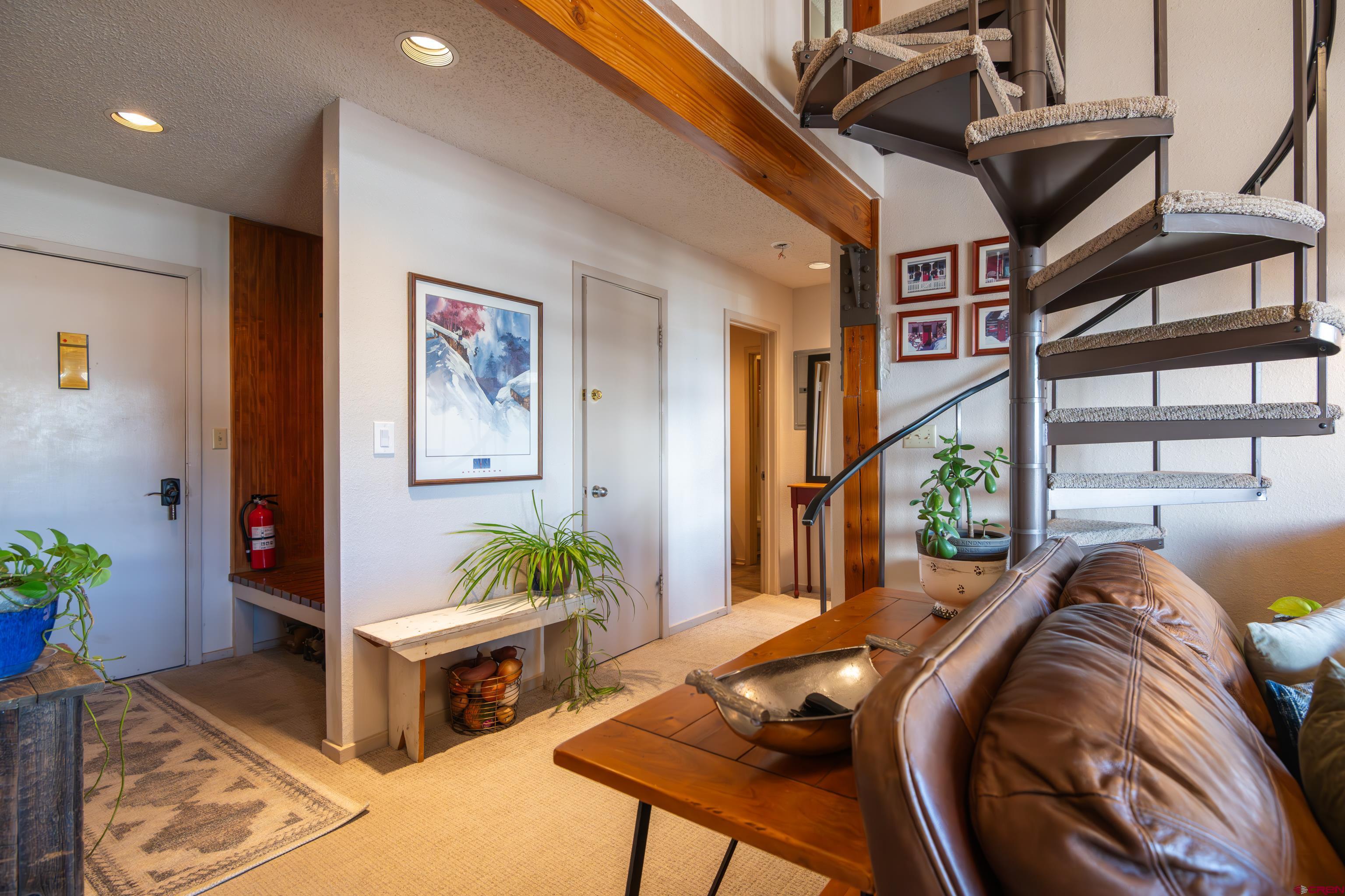 25 Emmons Road, Unit 41 Crested Butte, CO 81225 - Photo 2 of 45 a living room with furniture flowerpot and wooden floor