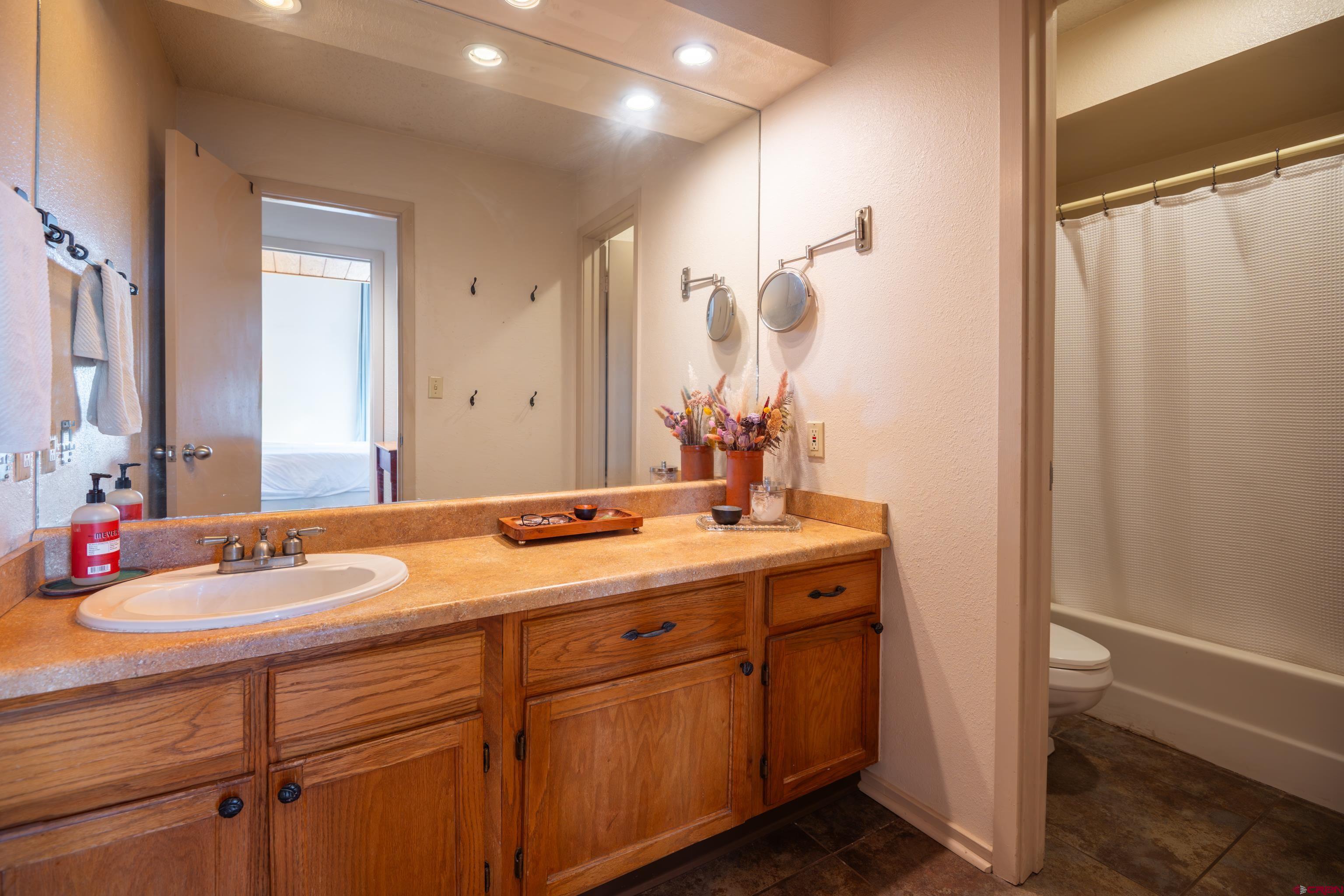 25 Emmons Road, Unit 41 Crested Butte, CO 81225 - Photo 23 of 45 a bathroom with a double vanity sink and a mirror