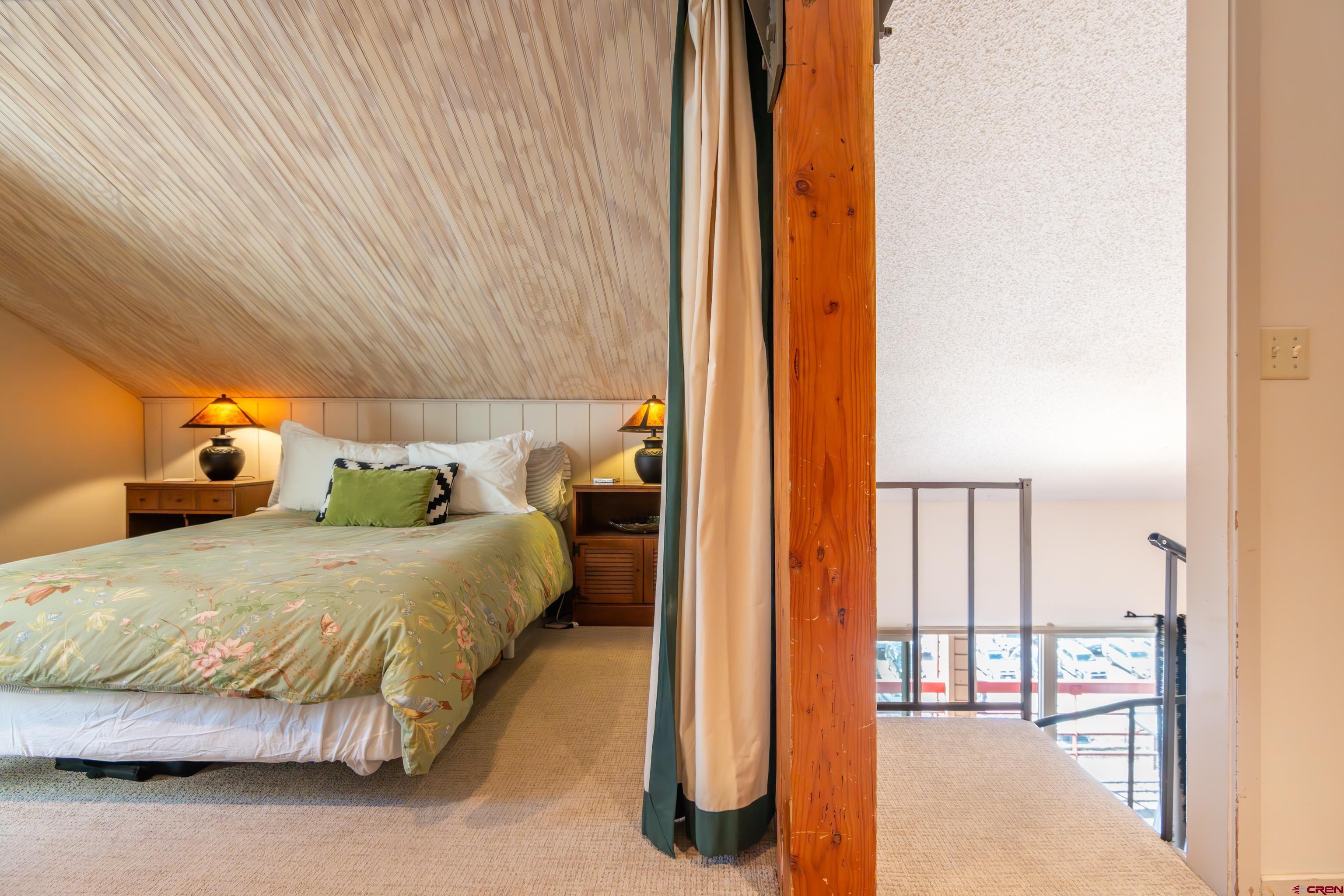 25 Emmons Road, Unit 41 Crested Butte, CO 81225 - Photo 30 of 45 a bedroom with a bed and a night stand