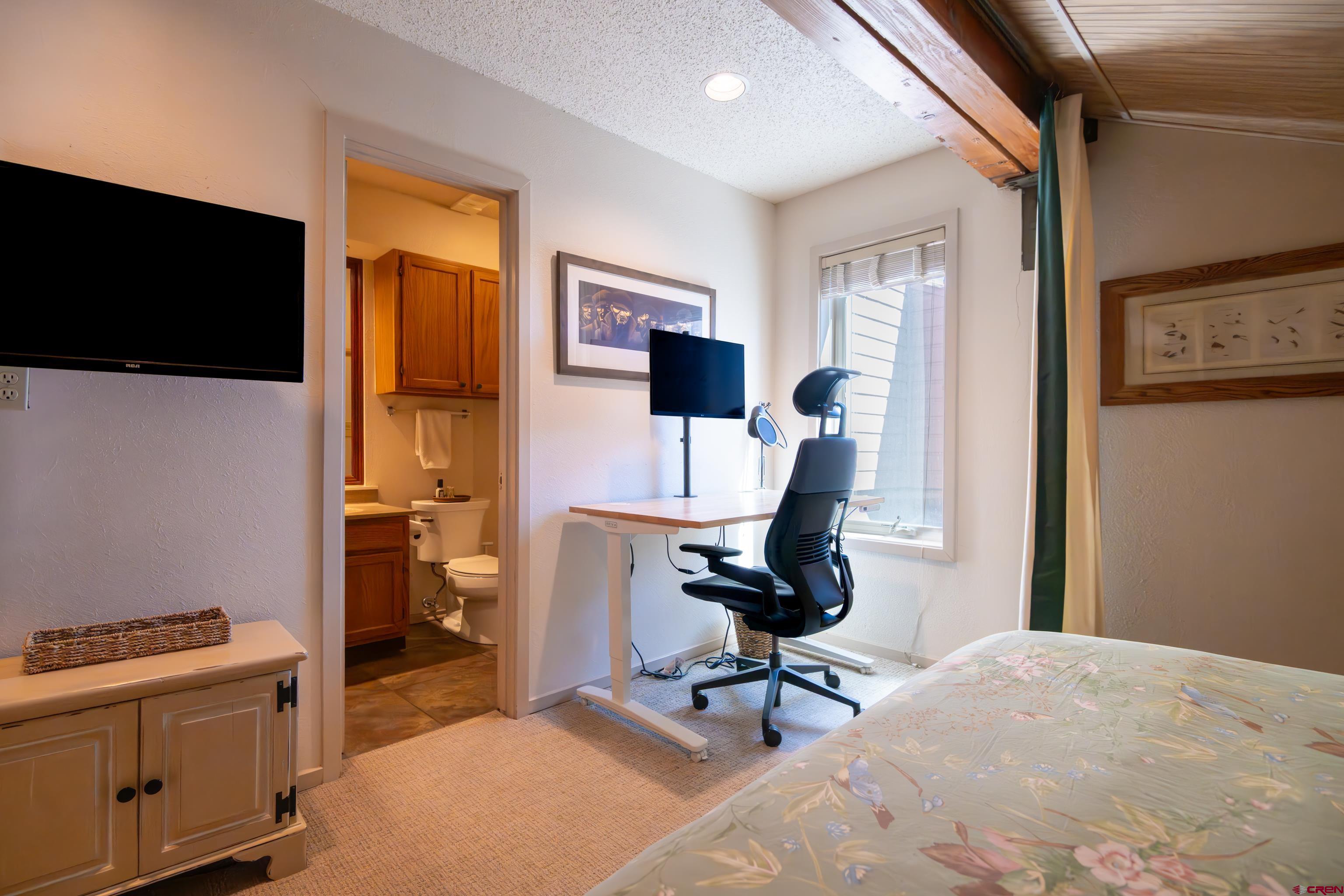 25 Emmons Road, Unit 41 Crested Butte, CO 81225 - Photo 33 of 45 a view of a workspace with furniture and a flat screen tv
