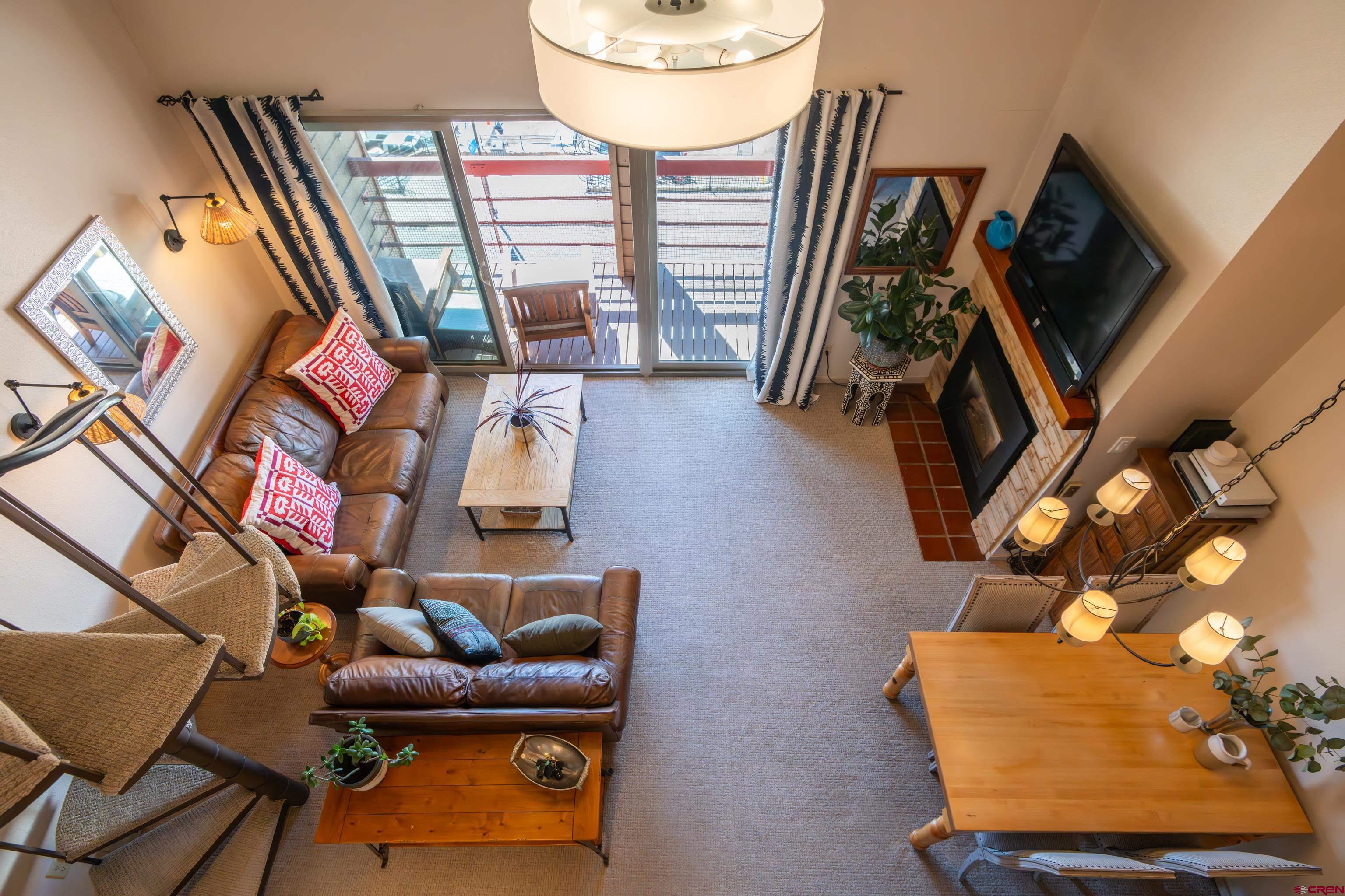25 Emmons Road, Unit 41 Crested Butte, CO 81225 - Photo 35 of 45 a living room with furniture and a flat screen tv