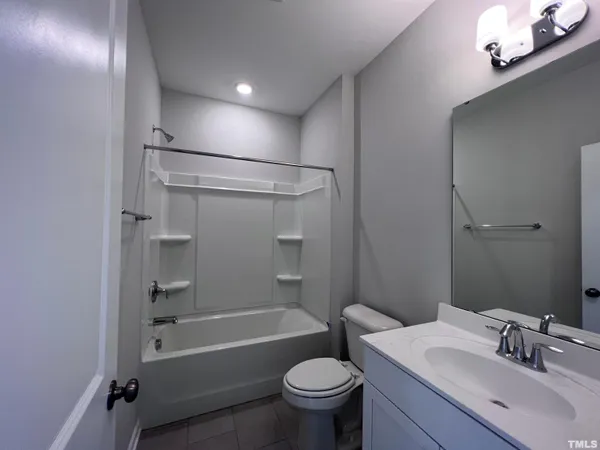 a view of a house with a small yard