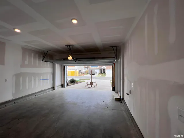 a view of a patio with table and chairs with wooden floor and fence