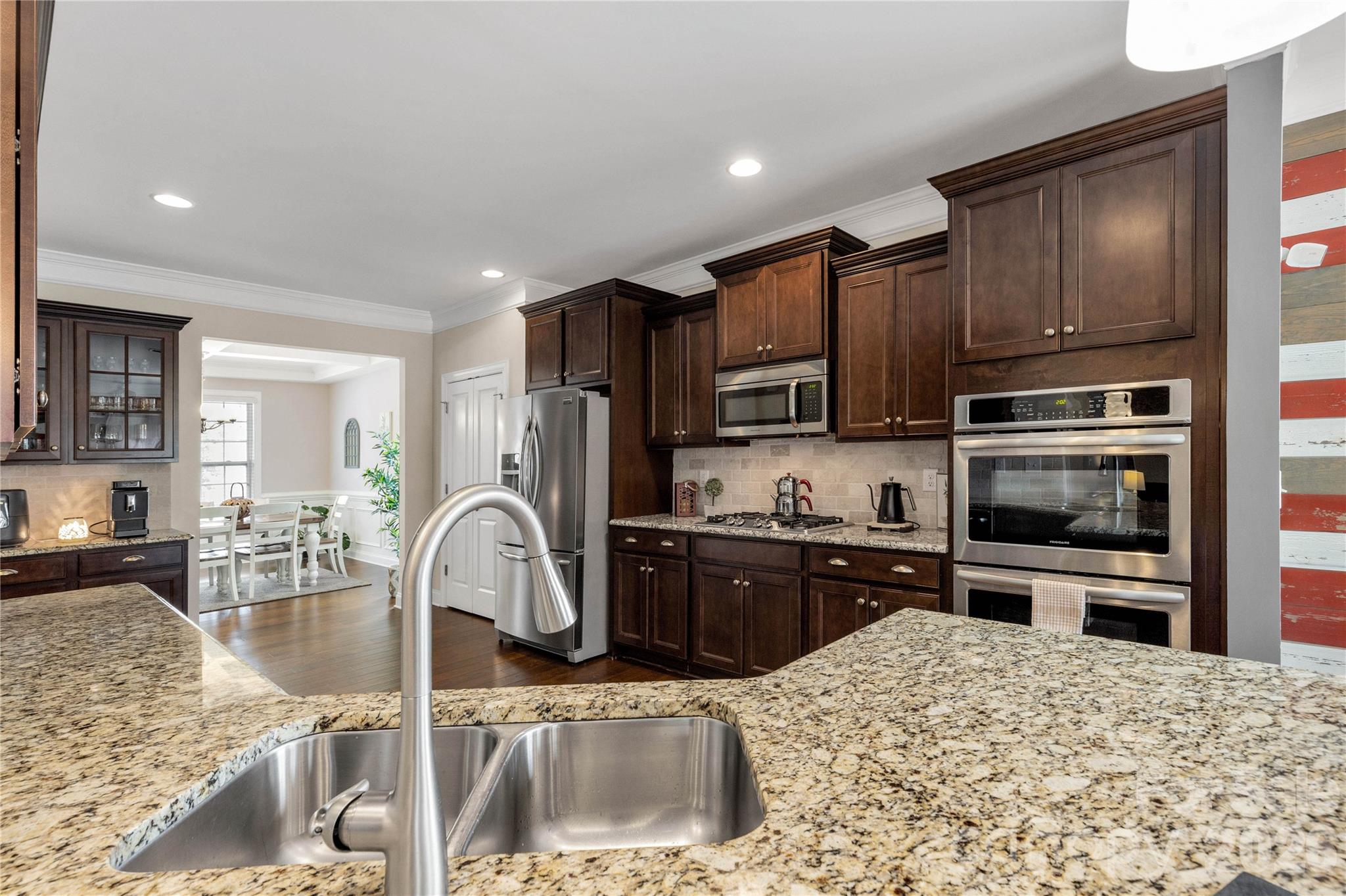 1372 Rainier Drive Fort Mill, SC 29708 - Photo 12 of 48 a kitchen with stainless steel appliances granite countertop a sink stove and refrigerator