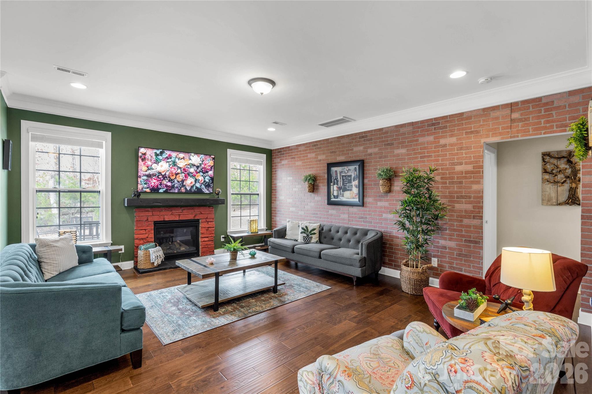 1372 Rainier Drive Fort Mill, SC 29708 - Photo 13 of 48 a living room with furniture a fireplace and a floor to ceiling window