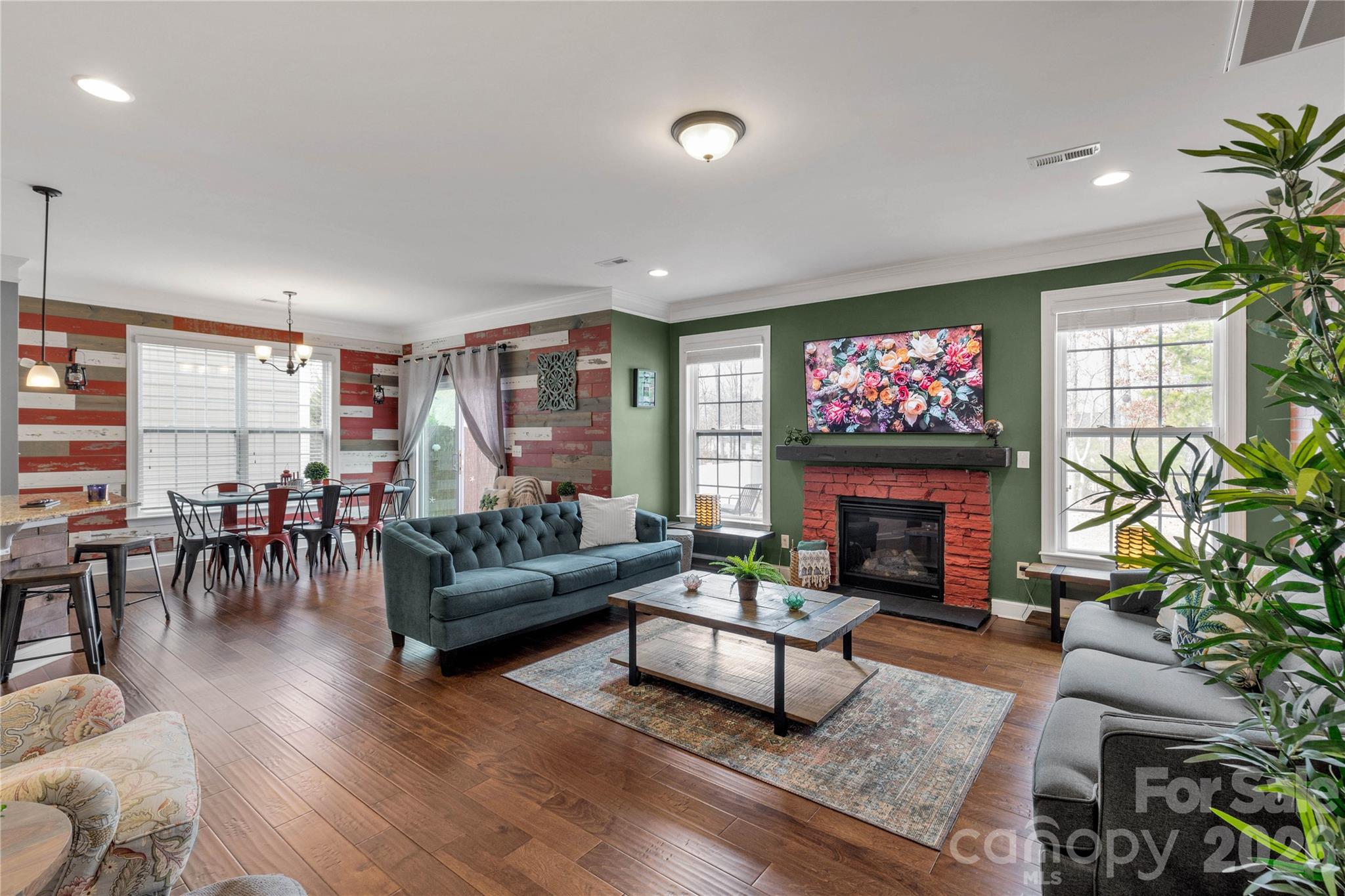 1372 Rainier Drive Fort Mill, SC 29708 - Photo 14 of 48 a living room with furniture a flat screen tv and a fireplace