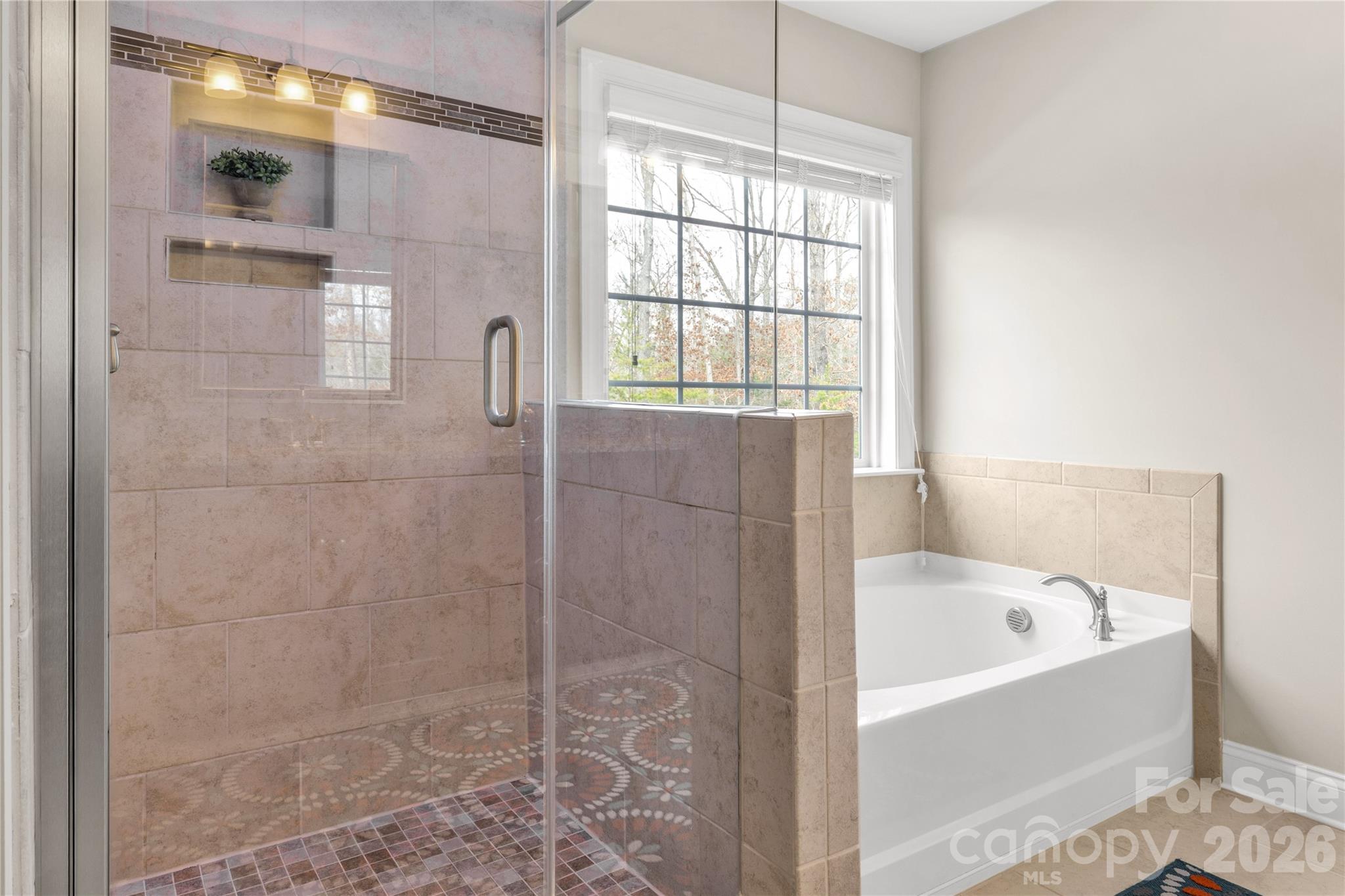 1372 Rainier Drive Fort Mill, SC 29708 - Photo 28 of 48 a bathroom with a bathtub and shower