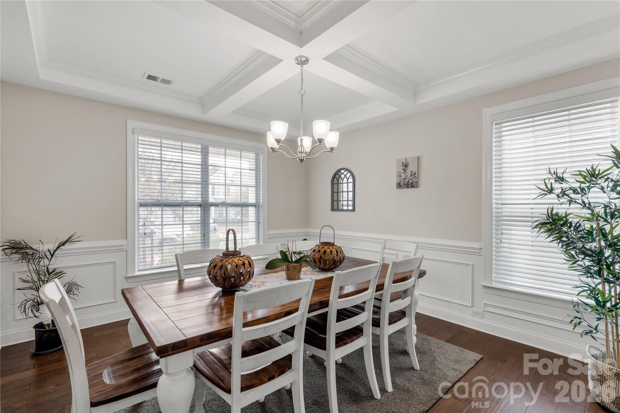 1372 Rainier Drive Fort Mill, SC 29708 - Photo 7 of 48 a dining room with furniture a chandelier and wooden floor