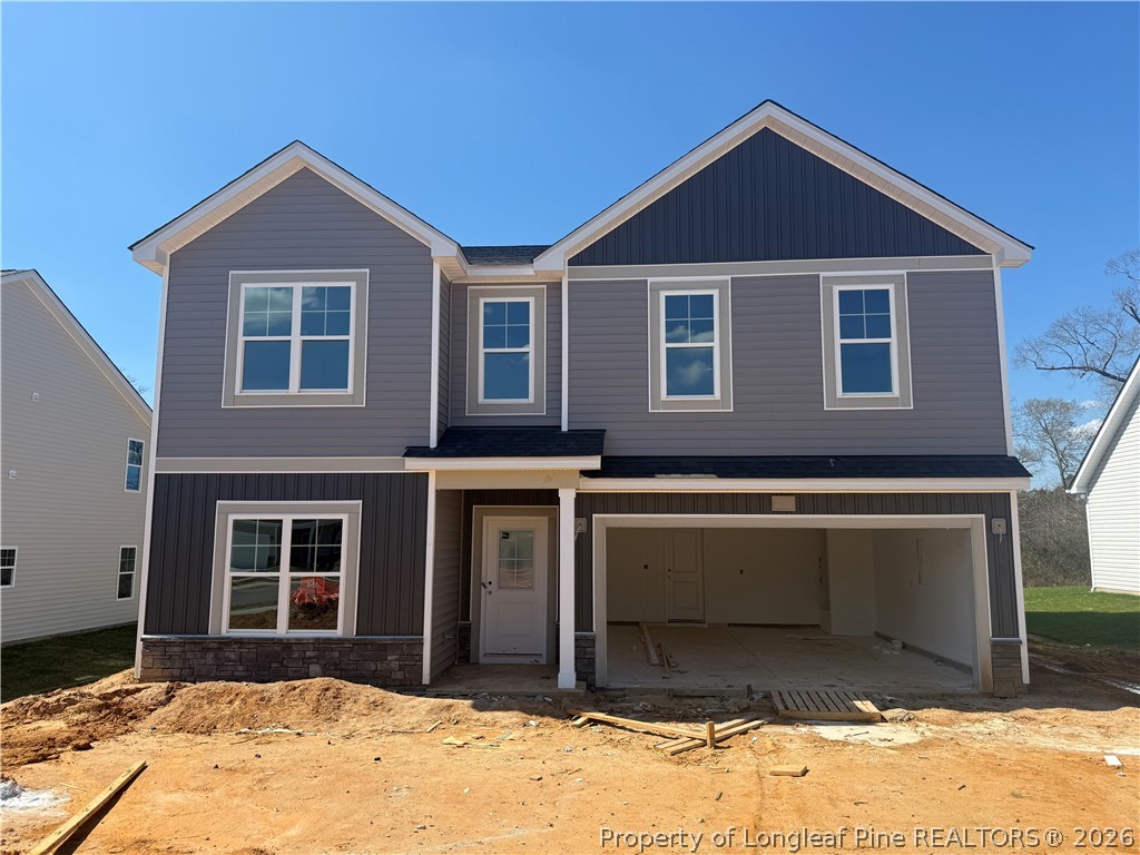 178 Brickendon Lane Raeford, NC 28376 - Photo 1 of 15 a front view of a house with a garage