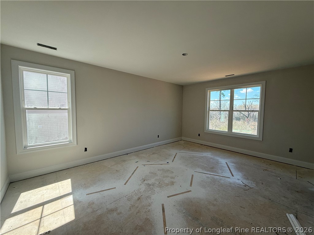 178 Brickendon Lane Raeford, NC 28376 - Photo 14 of 15 an empty room with windows