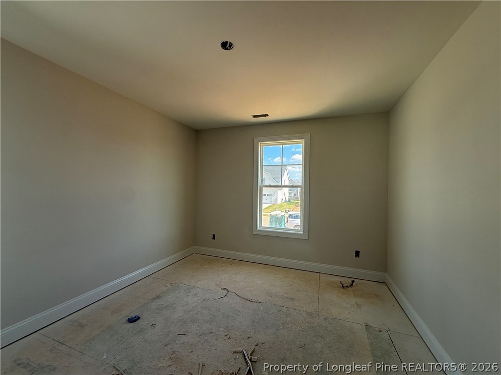 178 Brickendon Lane Raeford, NC 28376 - Photo 10 of 15 an empty room with a window