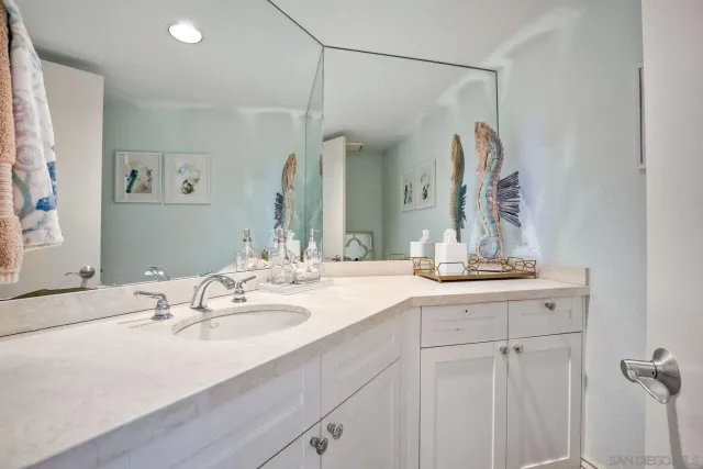 a view of a swimming pool and lounge chairs