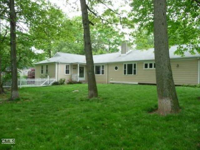 8 Blue Mountain Road Norwalk, CT 06851 - Photo 1 of 1 a view of house with a yard deck and a large tree