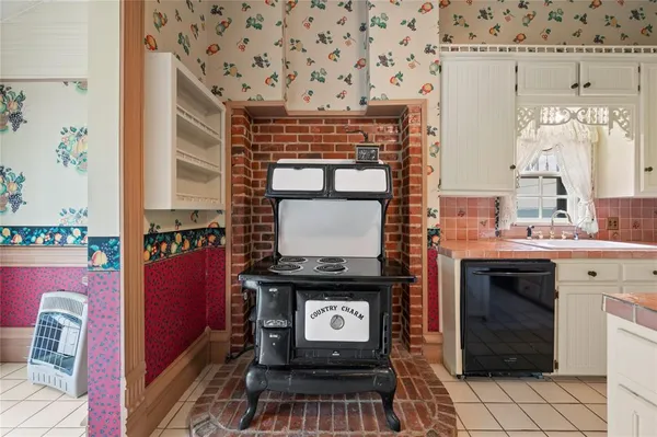 a kitchen with a stove and a microwave