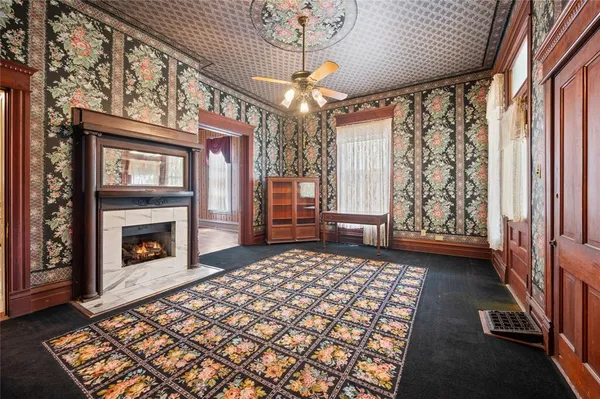 a bedroom with a bed and a fireplace