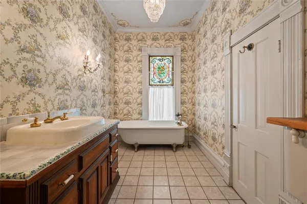 a view of empty room with a fireplace