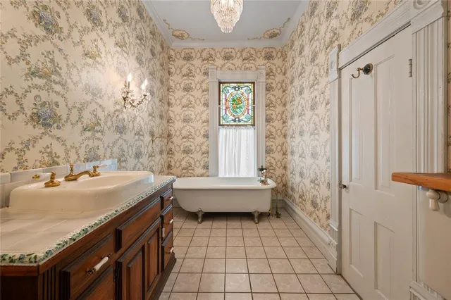 a bathroom with a double vanity sink toilet and shower