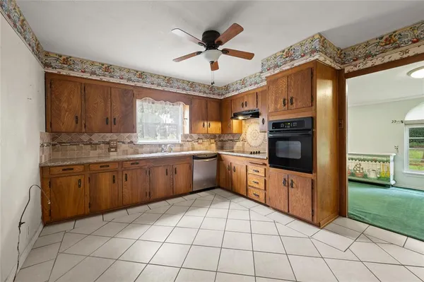 a bathroom with a double vanity sink toilet and shower