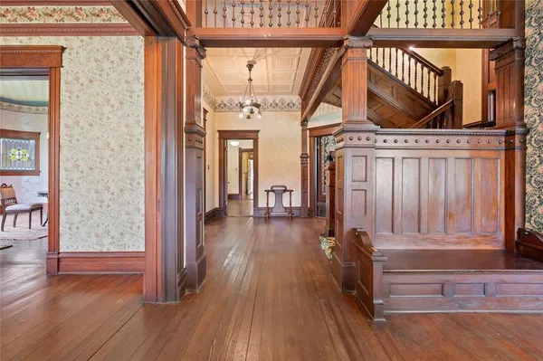 a view of entryway with wooden floor