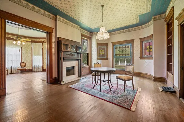 a view of a dining room with furniture window and wooden floor