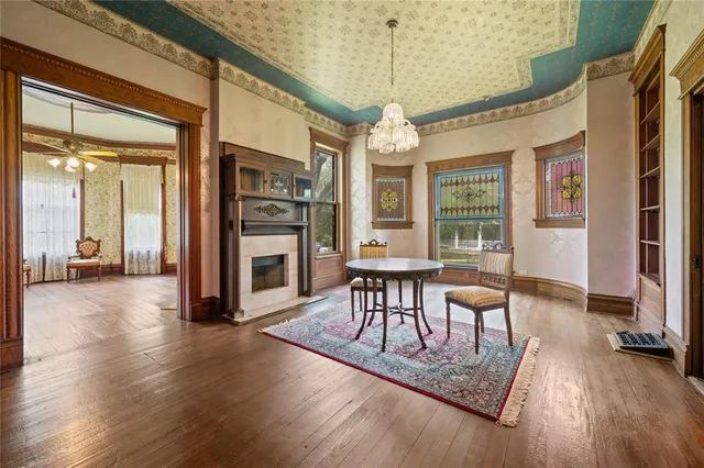 a bedroom with a bed and a fireplace