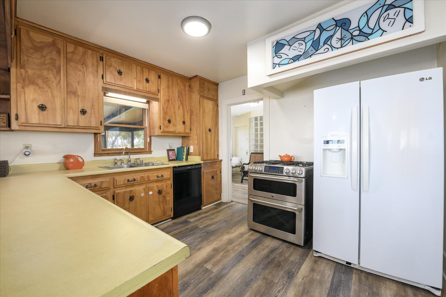 28968 County Road 26 Winters, CA 95694 - Photo 11 of 35 a kitchen with stainless steel appliances a stove a sink and a refrigerator
