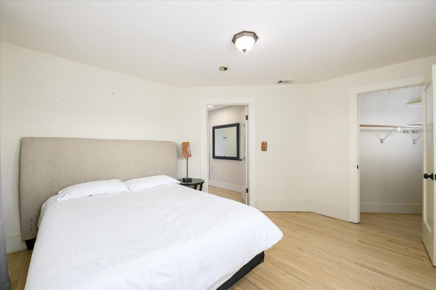 28968 County Road 26 Winters, CA 95694 - Photo 26 of 35 a bedroom with a bed and wooden floor