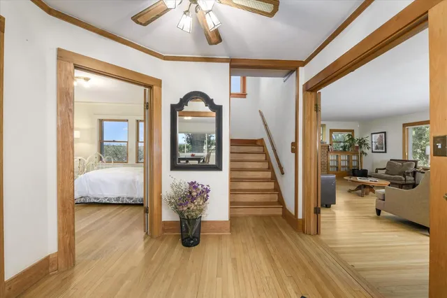a view of a livingroom with furniture and hardwood floor