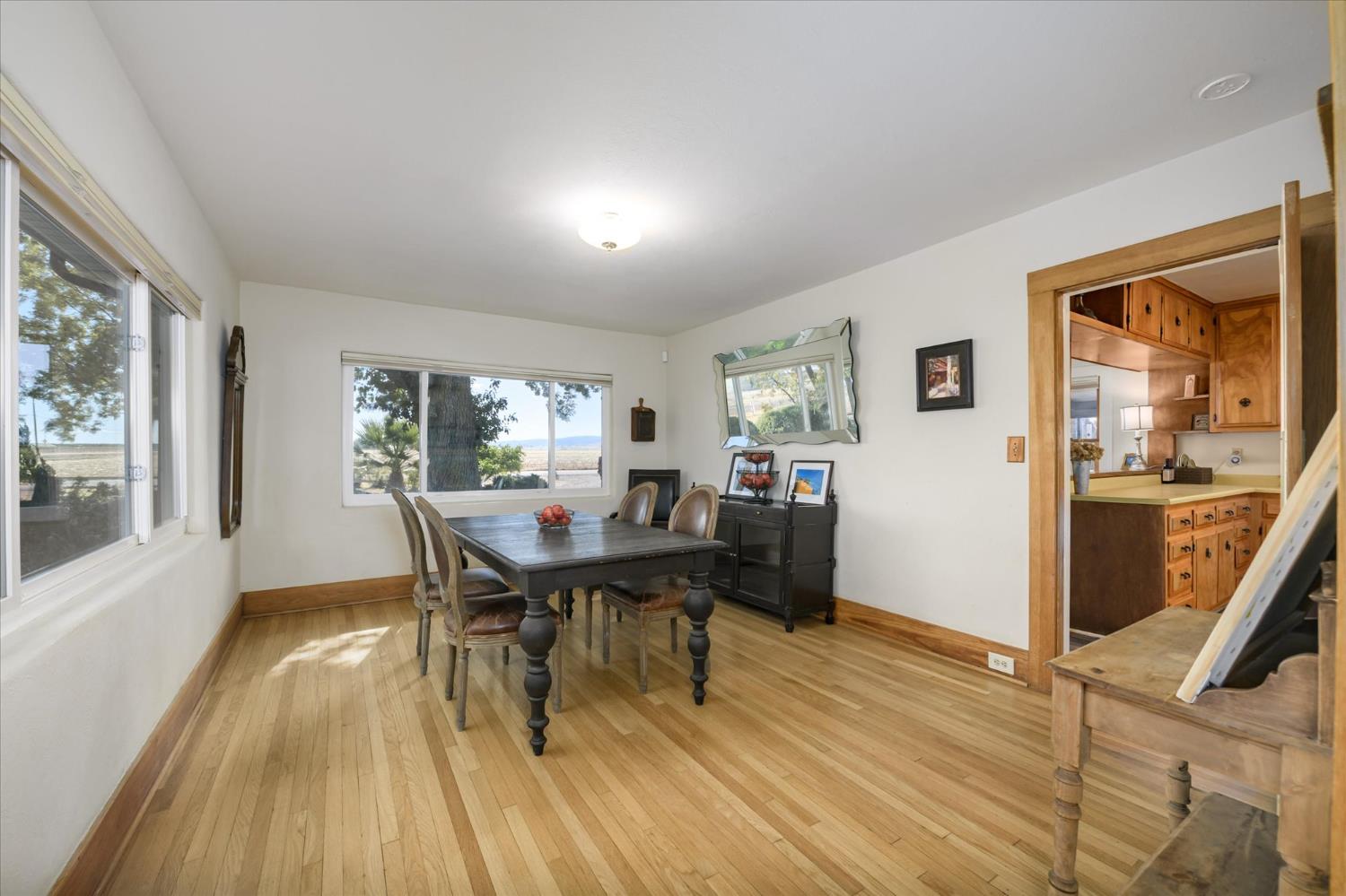 28968 County Road 26 Winters, CA 95694 - Photo 9 of 35 a view of a dining room with furniture and wooden floor