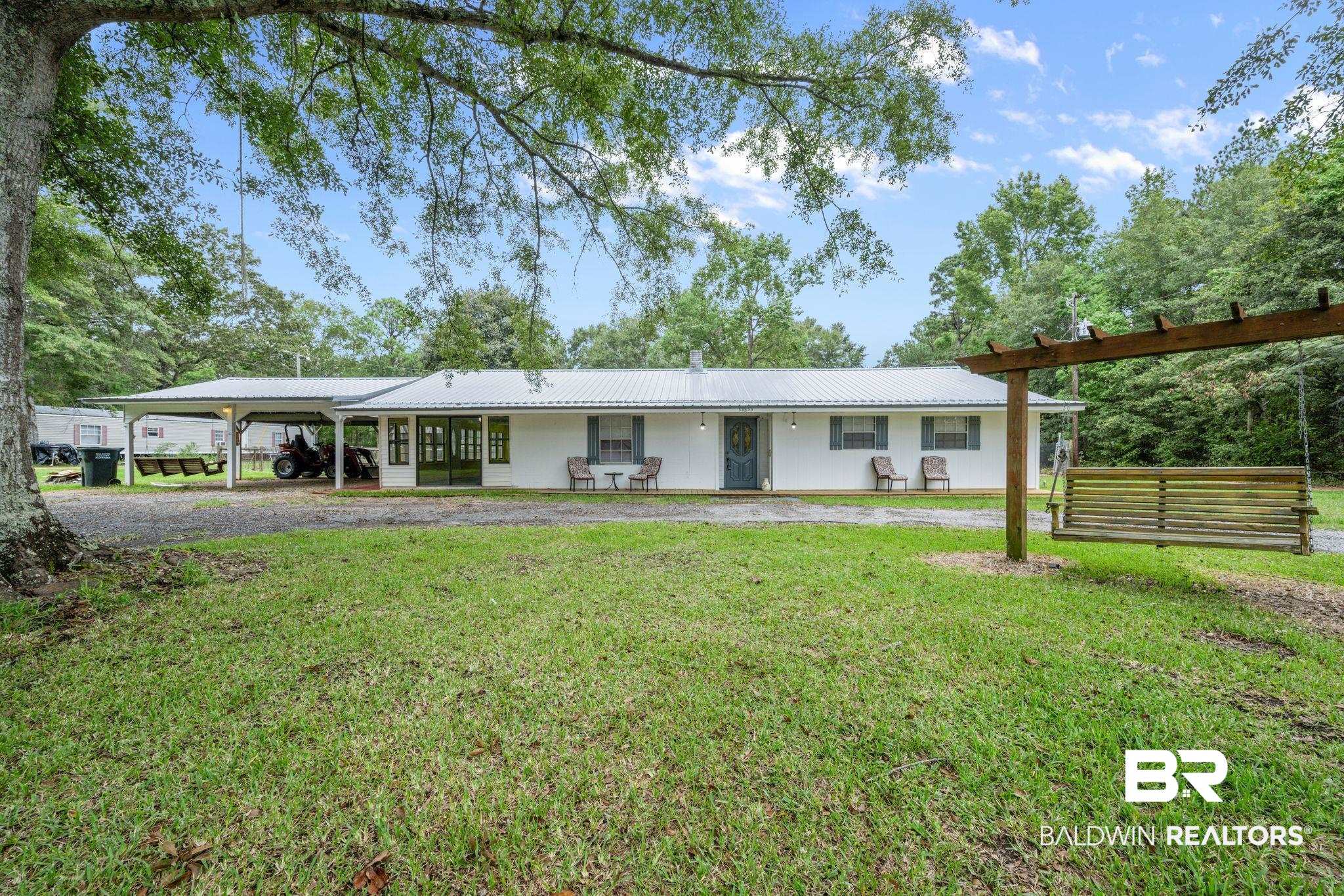 54855 Ramer Drive Bay Minette, AL 36507 - Photo 1 of 20 Ranch-style home with a front yard and a carport