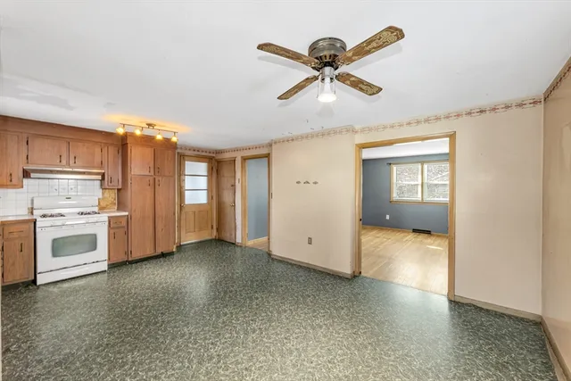 a view of a kitchen with a sink and dishwasher