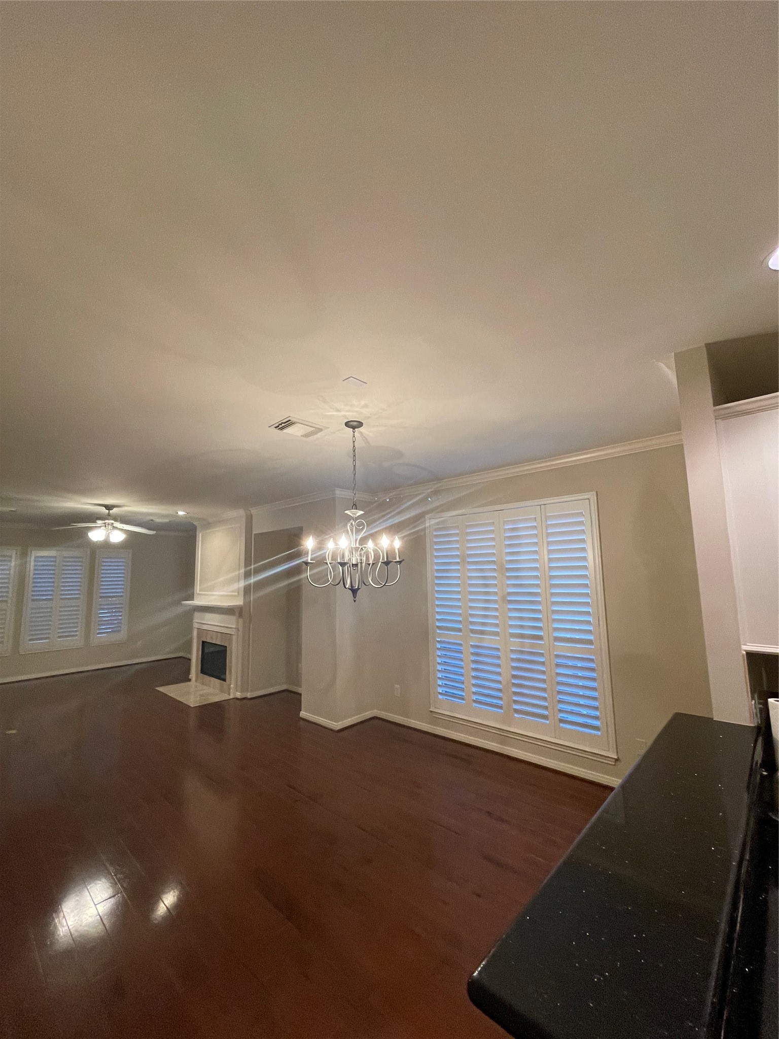 1040 La Rue Street Houston, TX 77019 - Photo 20 of 29 an empty room with windows and ceiling fan